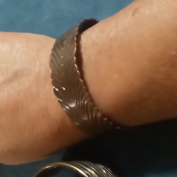 2 cuff bracelets one copper tone feather shaped one a brassy wire wrapped - Picture 3 of 4